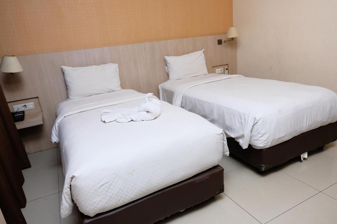Rio City Hotel Palembang Bagian luar foto
